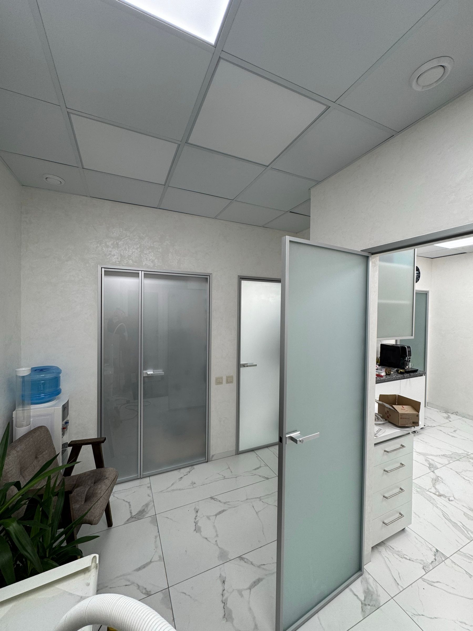 Frosted glass door in an aluminium frame in a dental clinic