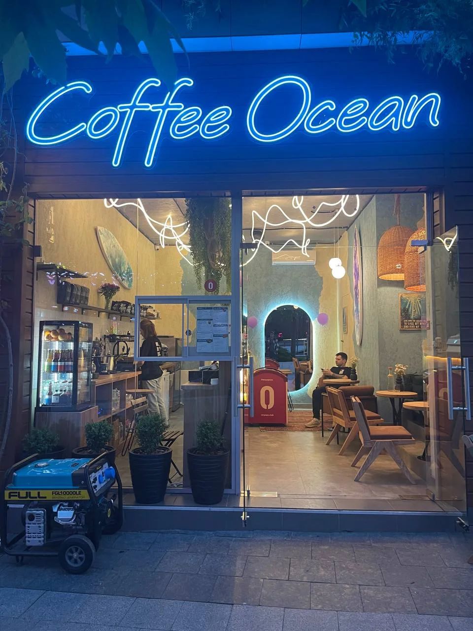 Glazed facade of the Coffee Ocean café in Odesa with the interior visible from outside